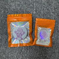 Bolsa de plástico para embalaje de Mylar con cremallera láser holográfica naranja transparente a prueba de olores resellable de grado alimenticio con logotipo personalizado