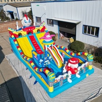 Château gonflable commercial à thème de film animé, grand format, en PVC, avec toboggan et zone de saut, prix usine