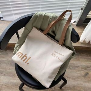 กระเป๋าผ้าใบสะพายไหล่สำหรับผู้หญิงแฟชั่นใหม่ความจุขนาดใหญ่กระเป๋าโท้ทสั่งทำสำหรับช้อปปิ้งพร้อมโลโก้พิมพ์ลาย - Product Image 6