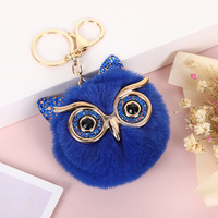 Porte-clés animal et décoration de sac Owen Porte-clés en peluche à pompons en fausse fourrure multicolore