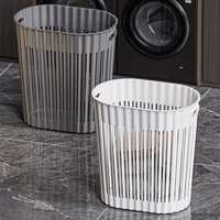 Panier de rangement en plastique ajouré respirant avec poignée de transport confortable, idéal pour le linge sale, la salle de bain et la chambre à coucher