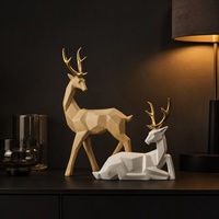 Ensemble de sculptures géométriques de cerfs scandinaves en bois et résine blanche, deux pièces, pour la décoration de salon