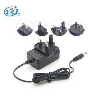 Reino Unido al por mayor cargador 18W 9V 2a Reino Unido AC DC enchufe 5, 5X2, 1Mm fuente de alimentación 12V 2A 24W adaptador de corriente de conmutación de montaje en pared