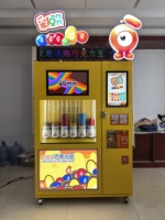 Distributeur automatique de chocolats à écran tactile commercial, acceptant plusieurs modes de paiement (QR, pièces, cartes, jetons) pour centres commerciaux et commerces de détail