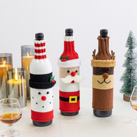 Nouvelle conception 2025, fournitures de décoration de Noël, housse de bouteille de vin rouge tricotée pour la table à manger, manchon de vin de Noël festif