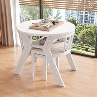 Ensemble de table et de chaises à manger en bois moderne et peu encombrant avec un design compact pour la cuisine ou la salle à manger