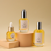 Flacon compte-gouttes ovale en verre transparent avec bouchon compte-gouttes métallique pour emballage de sérum essentiel pour le visage et cosmétiques de marque