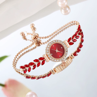 Nouvelle montre-bracelet élégante et décontractée pour femme avec un joli cadran rond, dotée d'un bracelet en forme de feuille et de plume N2604198