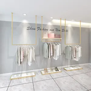 Custom Gold Clothing Storage Display Rack Design for Wall for Women Garment Store Layout