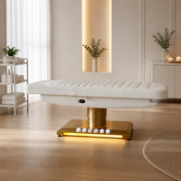 Cama de belleza eléctrica de 3 motores con columna dorada cepillada, base de luz LED cálida, orificio facial, para terapia, salón, spa, microblading, clínica