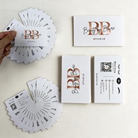 Stampa di biglietti da visita di lusso con stampa offset su carta patinata e laminazione in film