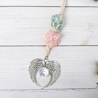 Vente en gros d'attrape-soleil en cristal k9 brut enveloppé d'aile d'ange brut attrape-soleil en cristal suspendu lune suncatche carillon éolien pendentif