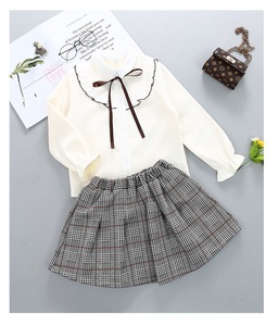 Produit chinois en gros, vêtements en coton tricoté, ensembles de chemisiers et jupes jaunes pour filles - Product Image 3