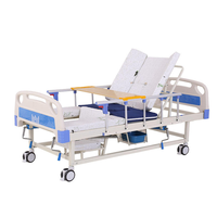 Lit médical et de soins à domicile multifonctionnel manuel avec trou pour commode, lit de soins à bascule réglable, table à manger et barreaux latéraux