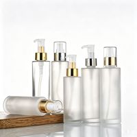 Flacon pompe à lotion rond en verre givré transparent de 60 ml, 80 ml, 100 ml avec bouchon supérieur noir, or, argent, logo personnalisé, utilisation cosmétique