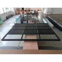 Fournisseur de portes de garage en aluminium blanc de 16 pieds de large et 8 pieds de haut avec cadre en alliage d'aluminium et verre isolant transparent ou givré