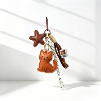 Breloque de sac en similicuir Sienna avec silhouette de chat et pendentif étoile brodé, attache tressée raffinée pour sac à dos et décoration de sac de transport