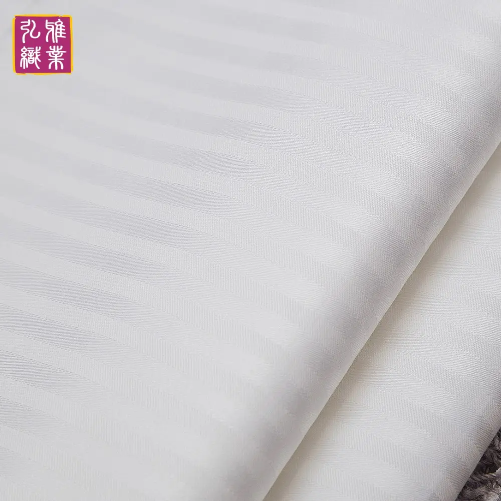 أغطية سرير قطنية من نانتونغ للفنادق 60*40 ثانية 300TC شريط أبيض مفارش سرير فنادق من الجاكار