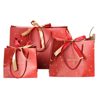 Sacs en papier personnalisés haut de gamme et luxueux, avec poignée en ruban vert intégré, logo gaufré, matériau durable pour les boutiques
