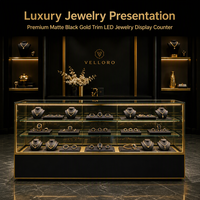 Comptoir de présentation de bijoux noir mat avec finition dorée, vitrine LED, étagères en verre pour magasin de détail