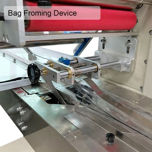 Máquina de embalaje de almohada de barra de energía automática de gran oferta Máquina de embalaje de barra de <span class=keywords><strong>cereales</strong></span> de proteína Máquina de embalaje de envoltura de barra de sésamo - Product Image 4
