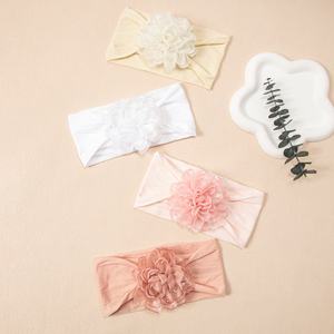 Bandeau élastique à fleurs en nylon à bord brûlé pour enfants Accessoire pour <span class=keywords><strong>cheveux</strong></span> fins de couleur unie Motifs de tissu mignons pour bébés tout-petits - Product Image 1