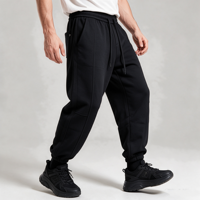 Pantalon de jogging fuselé noir pour homme avec revers, plis sur le devant, couture arrière, empiècement au genou, taille élastique, cordon de serrage et poches obliques, style streetwear