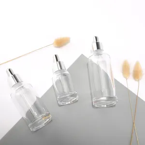 Flacon en verre d'épaule transparente oblique de luxe avec compte-gouttes en aluminium pour huile essentielle huile corporelle sérum de soin de la peau vente en gros