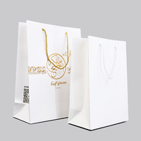 Sacs en papier blancs personnalisés avec logo, pour vêtements, chaussures, emballages cadeaux, sacs de shopping de luxe, avec poignée en ruban