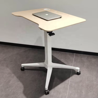 Bureau ergonomique en fer avec réglage pneumatique de la hauteur, roulettes mobiles, plateau rabattable à 90°, design moderne et compact, idéal pour usage commercial