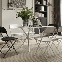 Chaise pliante portable en plastique blanc et noir pour événements extérieurs, idéale pour mariages et réceptions – Vente en gros directe usine