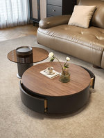 Table basse ronde vintage style crème, idéale pour les petits salons, avec une esthétique luxueuse et discrète d'inspiration française.