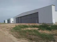 Hangar télescopique pour avions en acier industriel de haute qualité, porte coulissante, hangar pour avions, bâtiment métallique préfabriqué