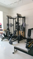 Vente en gros d'usine : Power Rack avec bras de jammer, sangles de sécurité et barre de traction, équipement d'entraînement de force pour usage commercial et domestique