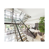 Escalier droit flottant de conception villa avec support en acier dissimulé et balustrades en verre pour escalier intérieur