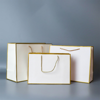 Sacs cadeaux de luxe noirs en feuille d'or avec logo personnalisé respectueux de l'environnement sacs à provisions sacs en papier carton