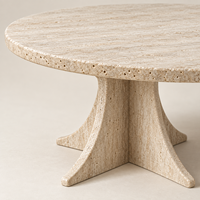 MEUBLES JIAMEIJIA |   Table basse ronde effet travertin avec piétement sculpté en forme de croix