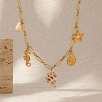 Collar de cadena de acero inoxidable con dijes de ala de ángel, corazón, concha, caballito de mar, estrella de mar y caracola para mujer, venta al por mayor