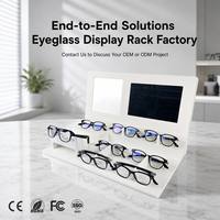 Présentoir à lunettes multi-niveaux en acrylique blanc avec miroir intégré, écran numérique, zone d'affichage et éclairage alimenté pour comptoir