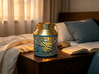 Lanterne en métal bleu sarcelle à découpes en forme de feuille, lanterne décorative portable en fer avec bordure dorée, option d'éclairage LED personnalisable