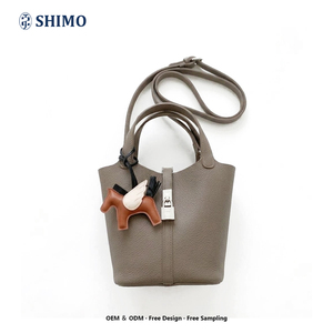 Op maat gemaakte logo-emmertjestas, kleine minimale bestelhoeveelheid 50 stuks, modieuze lederen handtas met slot, crossbody schoudertas, shopper voor online DTC-merken - Product Image 1
