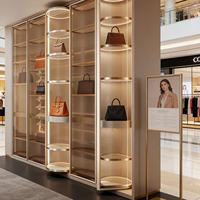 Automatische 360° Rotierende LED-Beleuchtung Vitrine für Handtaschen Moderne Einzelhandels-Ausstellungsraum-Präsentation Aluminiumlegierungsrahmen Maßgefertigte Größe Taschen-Display