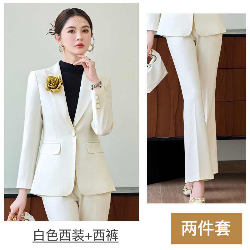 White suit with flared trousers and a corsage