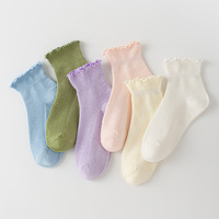 Chaussettes à volants fantaisie populaires pour femmes, chaussettes à volants mignonnes pour femmes, chaussettes en coton de couleur unie absorbant la transpiration, chaussettes à volants blanches pour filles