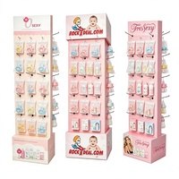 Présentoir multi-faces en carton FCS recyclable pour produits de maternité et de puériculture / Sucettes / Biberons