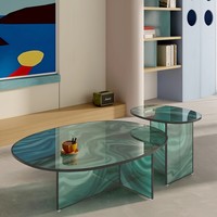 Table basse ovale en verre transparent à motif tourbillonnant, plateau asymétrique, modèle vague, style contemporain de luxe pour la maison