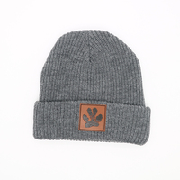 Patch en cuir personnalisé Logo hiver chaud 100% acrylique matériel gros Sports de plein air crâne unisexe laine bonnet tricoté bonnet chapeaux