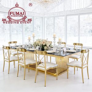 โต๊ะรับประทานอาหารกลางแจ้งทรงสี่เหลี่ยมผืนผ้ากระจก โมเดิร์น ยี่ห้อ Fumai รุ่น MG-205 โครงเหล็กกล้าไร้สนิมเคลือบทอง จาก Foshan Hotel Furniture - Product Image 1