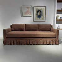Canapé d'angle trois places en lin plissé, design français moderne et luxueux, confortable, avec pompons, pour la décoration intérieure d'hôtel