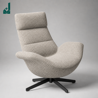 Fauteuil lounge ergonomique moderne à dossier haut en tissu avec base croisée pour zone de réception, bureau, usage commercial